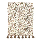 Into the Woods table runner featuring woodland animal and mushroom print on a cream background with brown tassels.