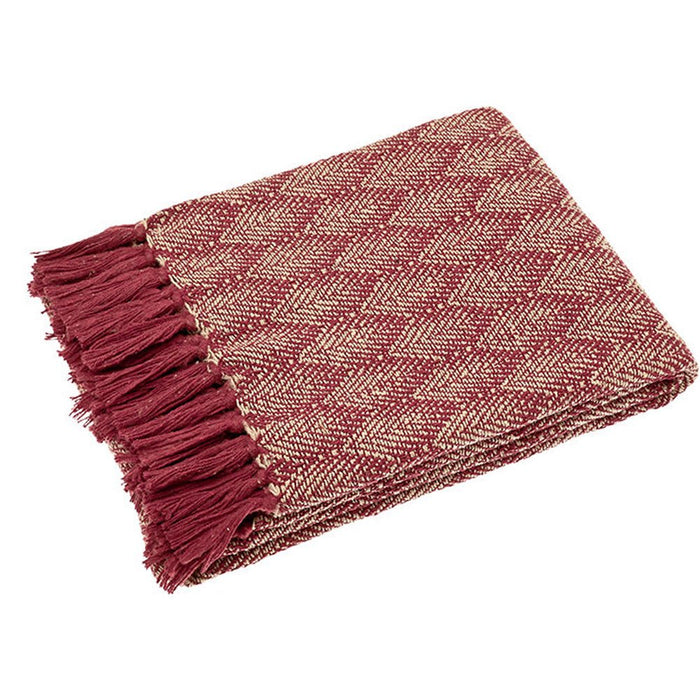 Folded mulberry recycled cotton throw with chevron weave and matching tassel fringe against a white background.