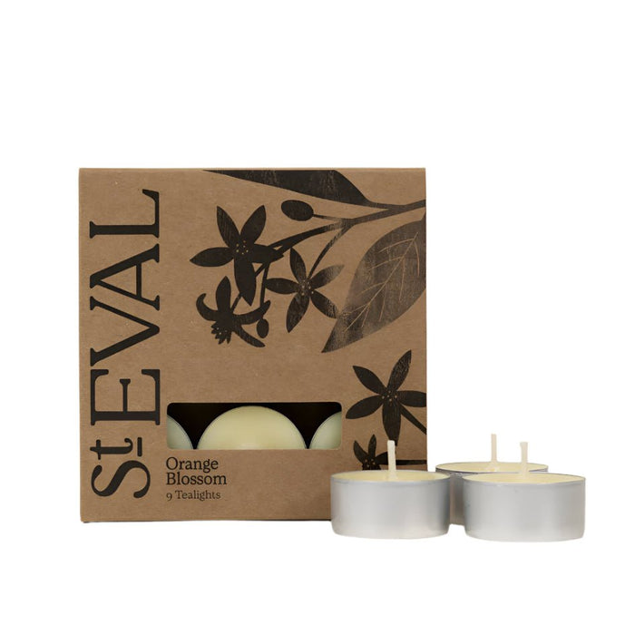 Recyclable brown card packaging for Orange Blossom tealights with three white candles displayed in front.