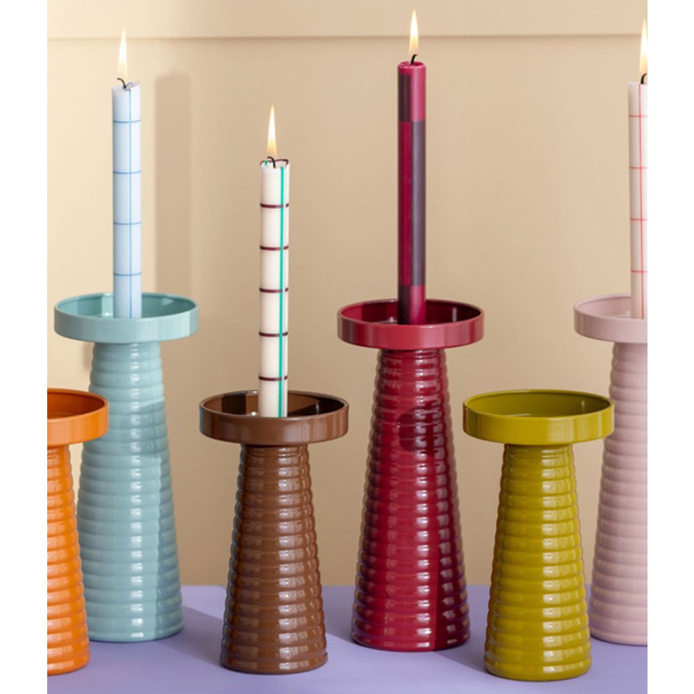 A collection of ribbed Catania candle holders in various colours including orange, blue, brown, red, green, and pink.
