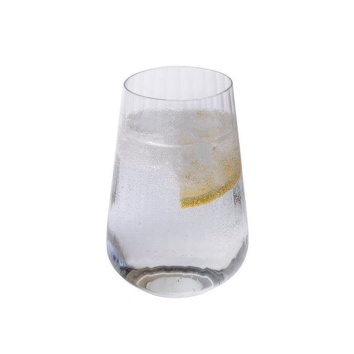 A single tall optic crystal tumbler filled with a sparkling clear drink, ice, and a lemon slice.