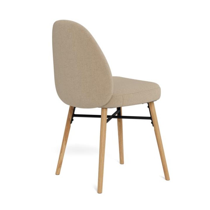 Three-quarter view from behind the Sophia dining chair showing its elegant profile