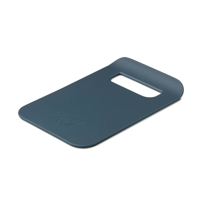 Dark blue slim chopping board with integrated handle and transfer chute