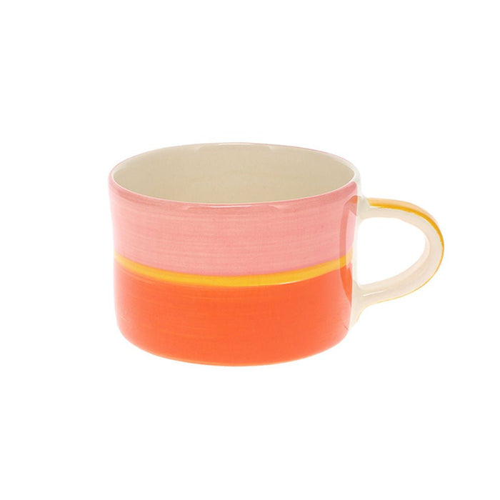 Handmade Sunrise Tri-Colour Mug featuring horizontal bands of pink, yellow, and orange glaze.