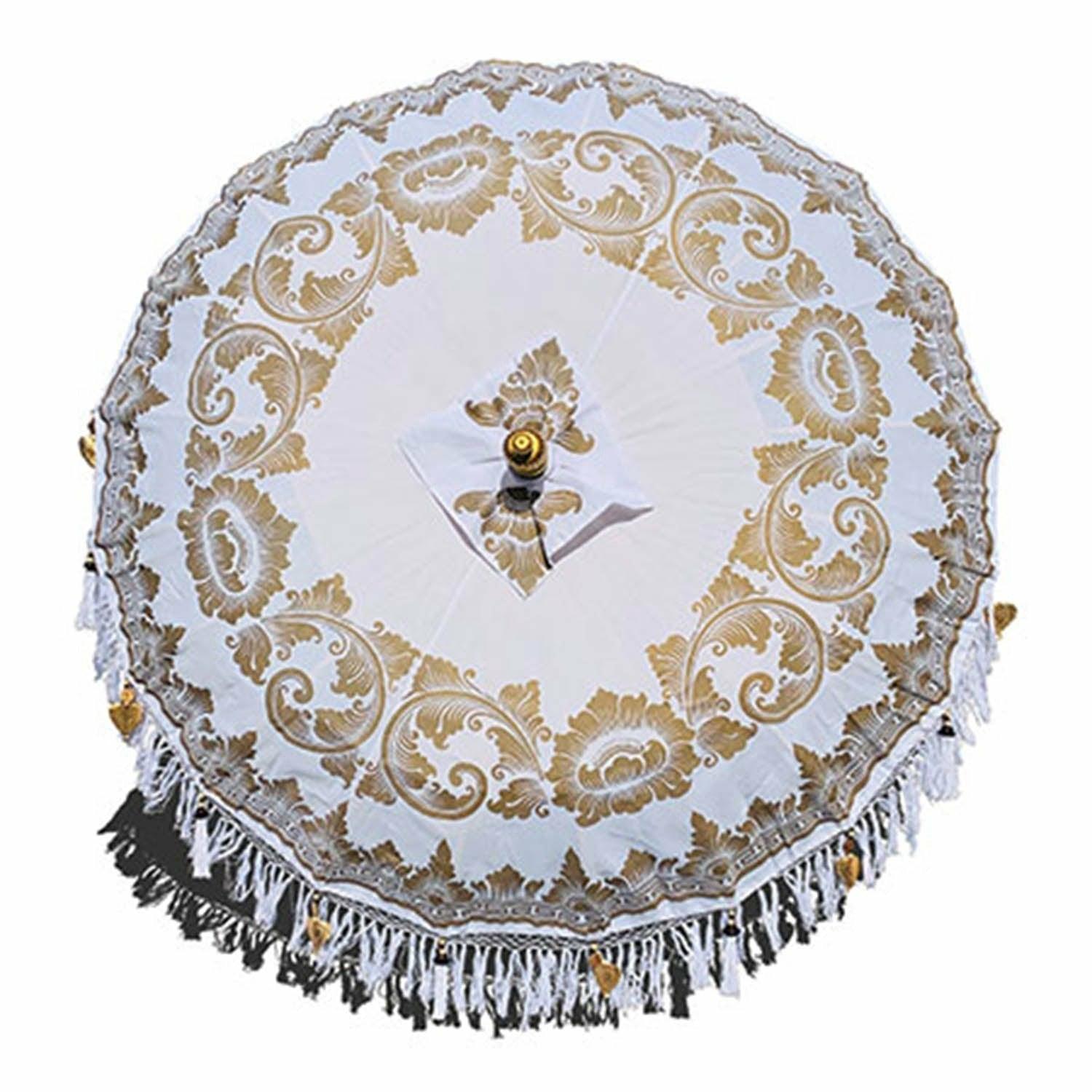 Top-down view of the cloud white parasol canopy showing intricate hand-painted gold scrollwork patterns.