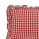 Close-up of red gingham linen fabric and frayed ruffle edge detail