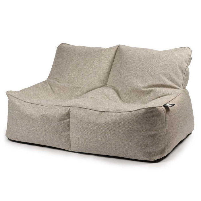 Beige two-seater bean bag chair with a textured fabric finish and supportive high back.