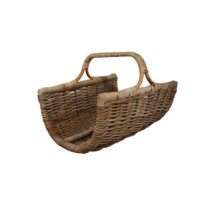 Large rattan log holder with a sturdy loop handle shown from an angled perspective