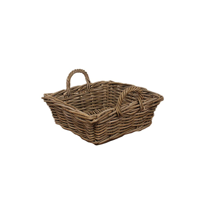 Angled view of a square low-profile rattan storage basket with two sturdy woven handles