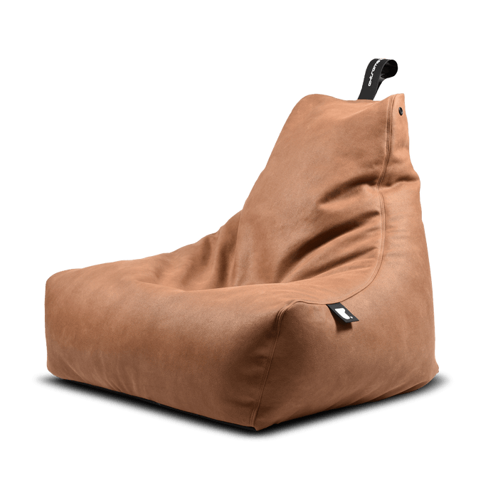 Light tan faux leather bean bag with a high back and black carry handle against a black background
