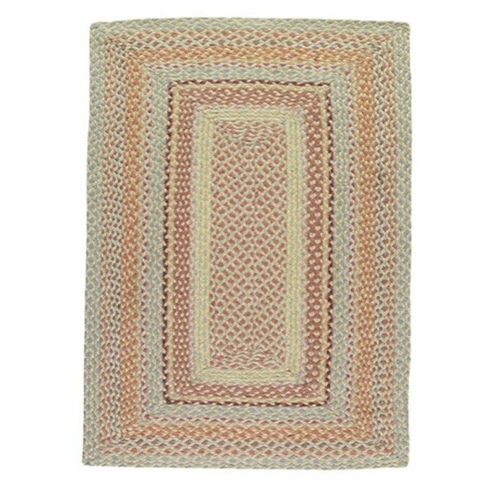 Pampas Jute Rug showing a rectangular woven pattern with soft red, earthy orange and pale green tones.