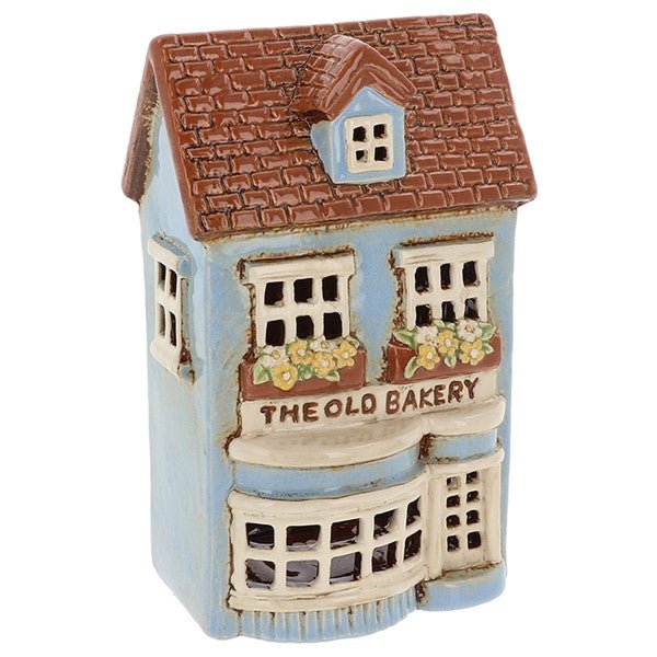 Blue pottery village bakery tealight house with brown tiled roof and floral window boxes