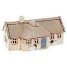 Handmade cream pottery crofter cottage tea-light holder with thatched roof and small sheep figures at the front