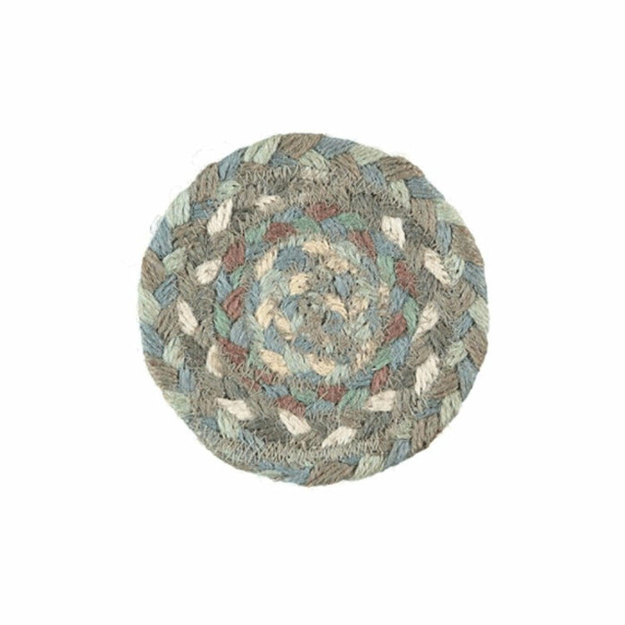 Single round Seaspray coaster showing braided organic jute in neutral, blue and earthy tones
